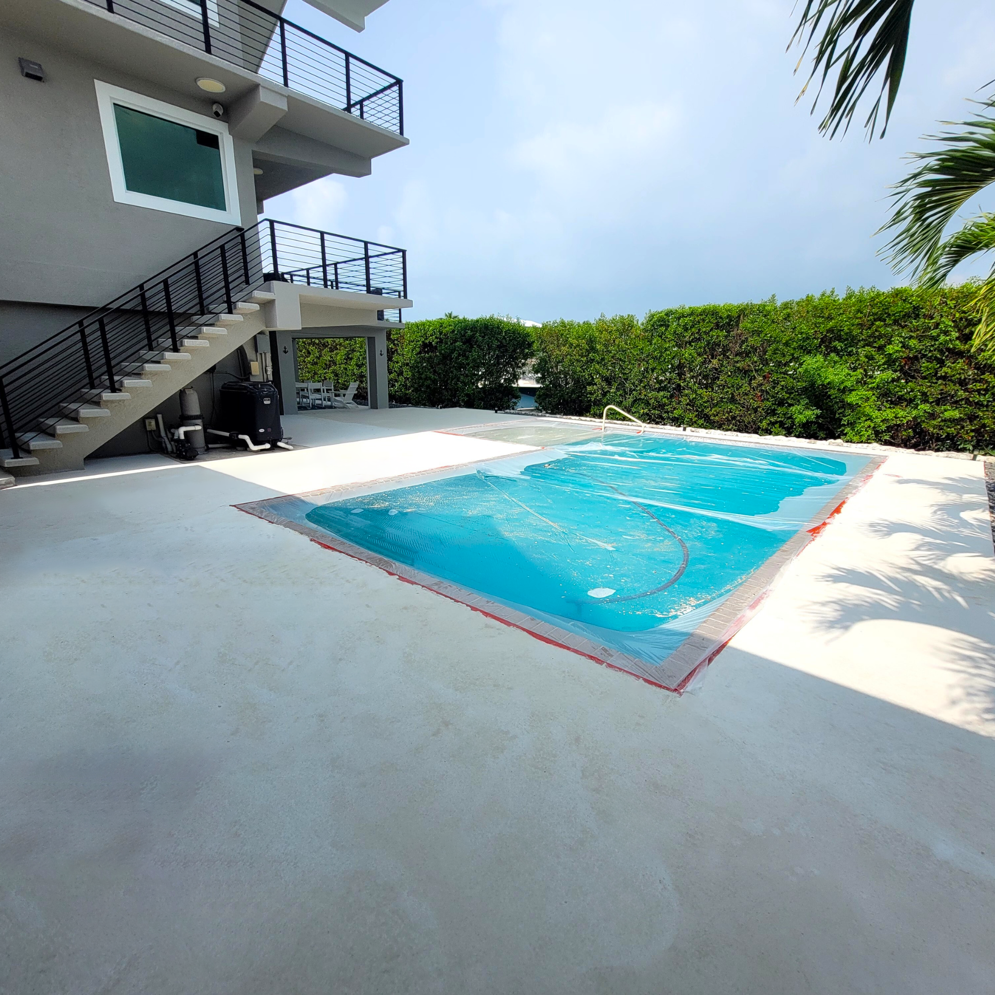 Textured spray deck for a residential Vredenburh Residence pool in Key Largo After work