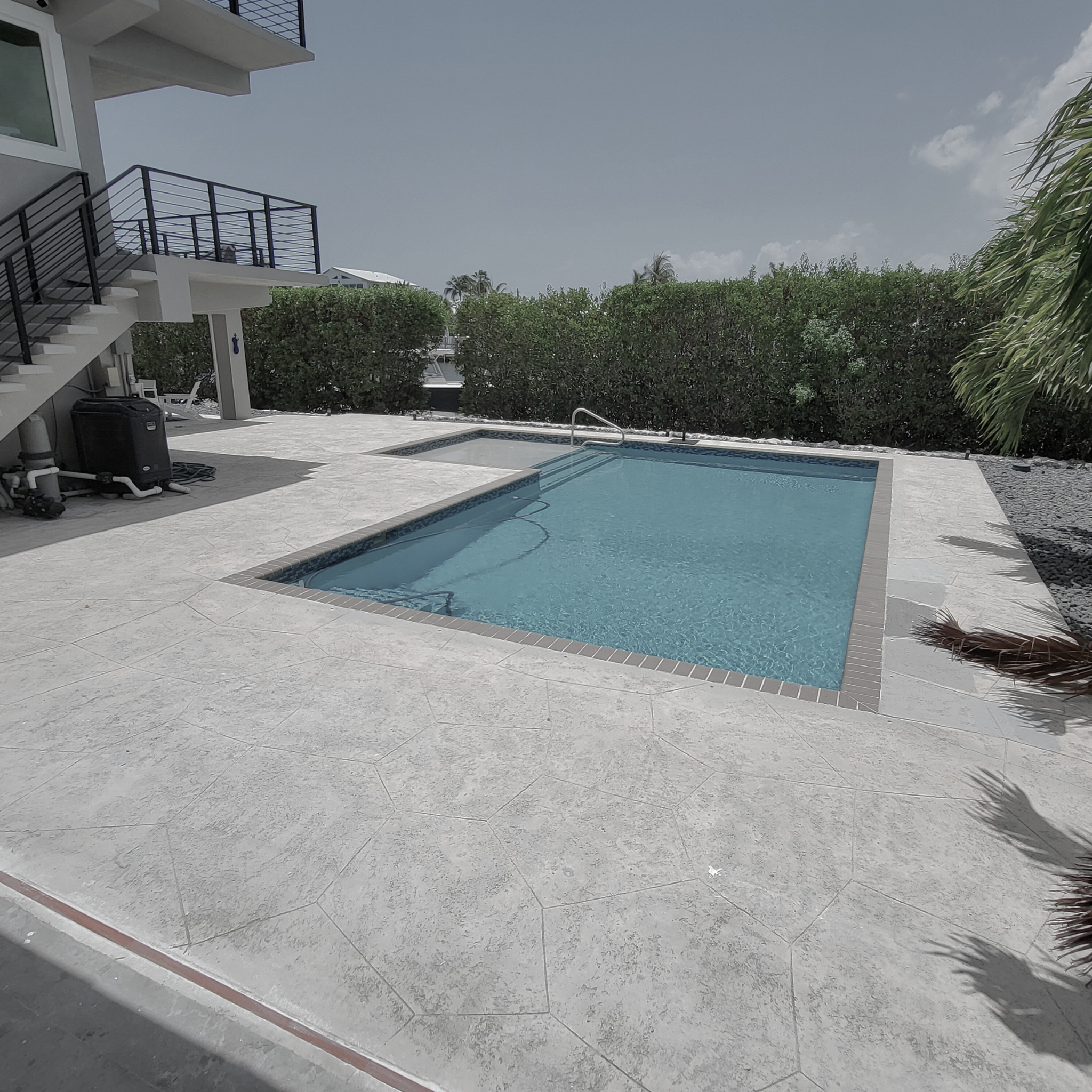 Textured spray deck for a residential Vredenburh Residence pool in Key Largo Before work